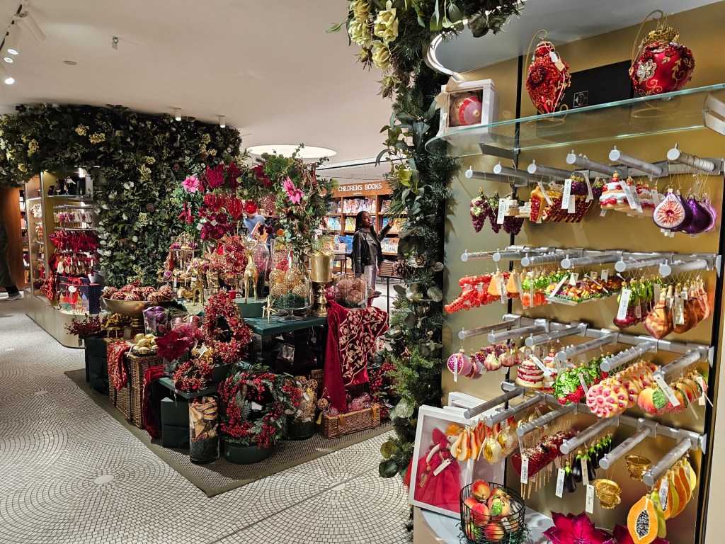 Shelves full of Christmas ornaments in Harrods, London