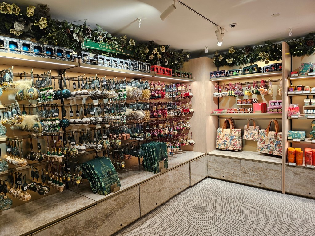 Shelves full of Christmas ornaments in Harrods, London