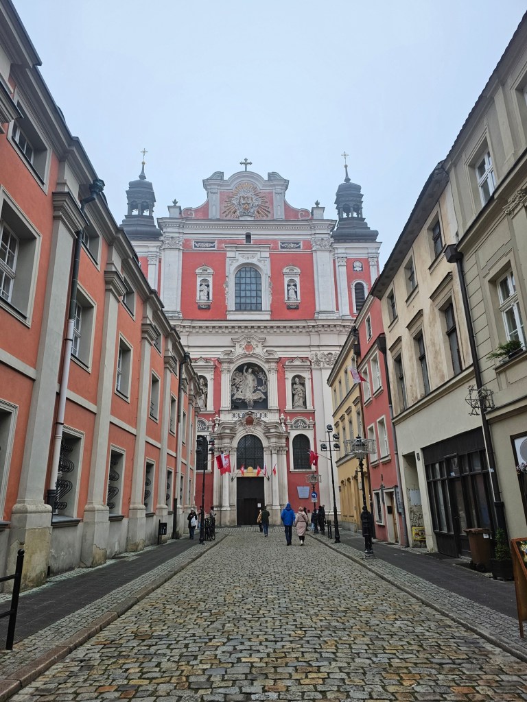A road lined with beautiful buildings in Poznan