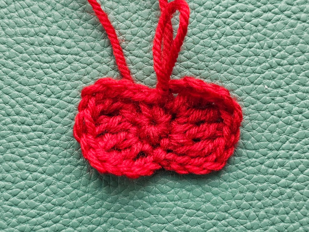 Crocheted small red bowtie