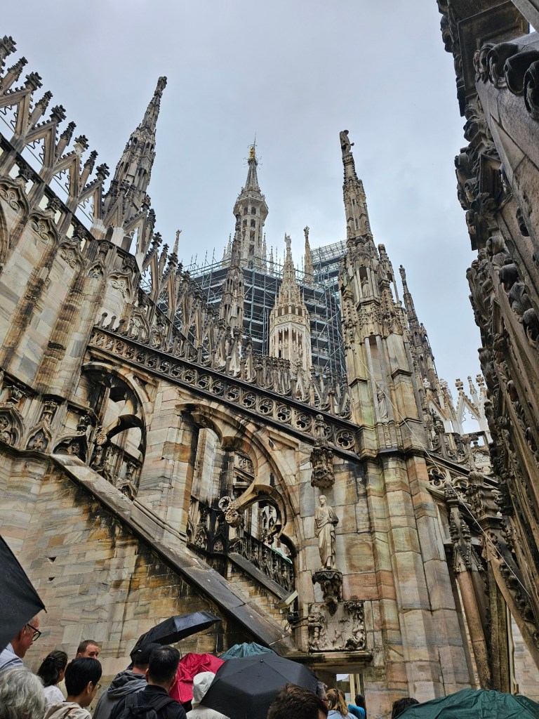 The rooftop terraces of Duomo di Milano in the rain