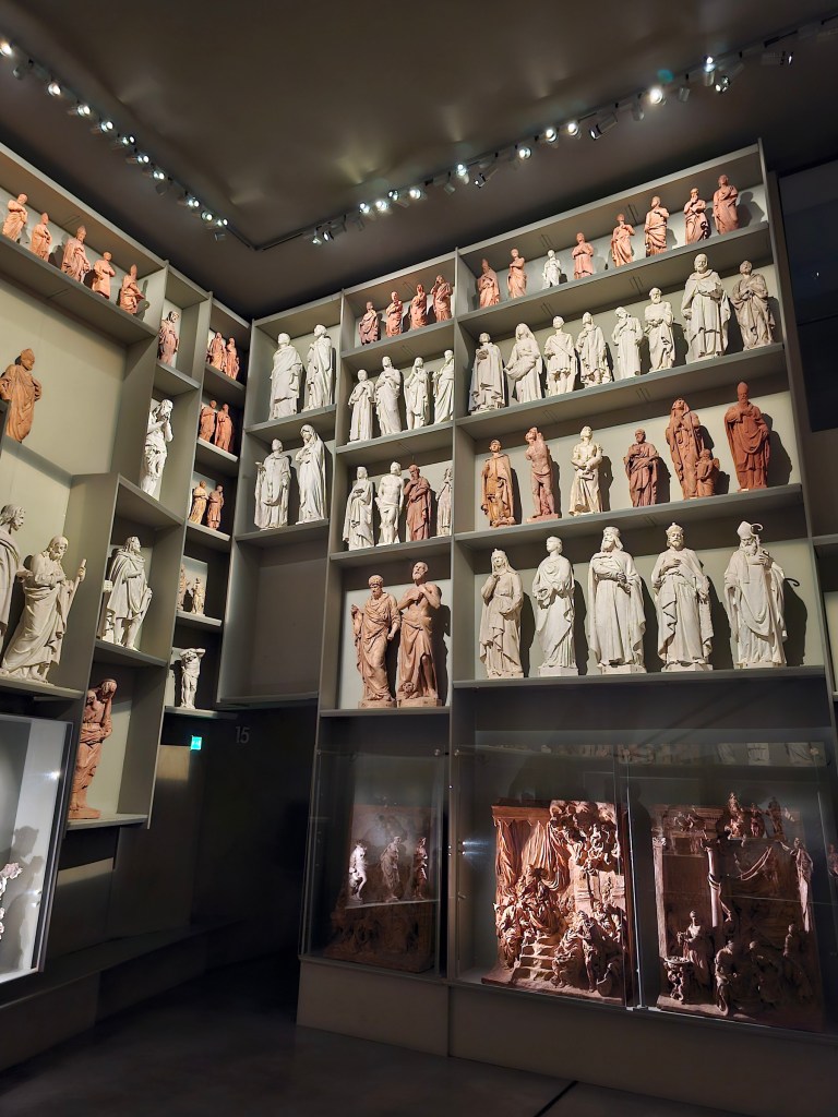 Dozens of small statues in a museum of Duomo di Milano