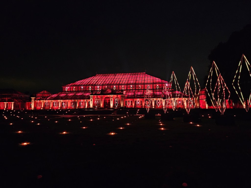 Illuminated palm house in Kew Gardens during the Christmas event, at night
