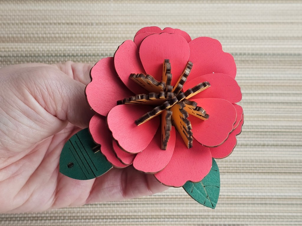 Nearly assembled red 3D wooden flower