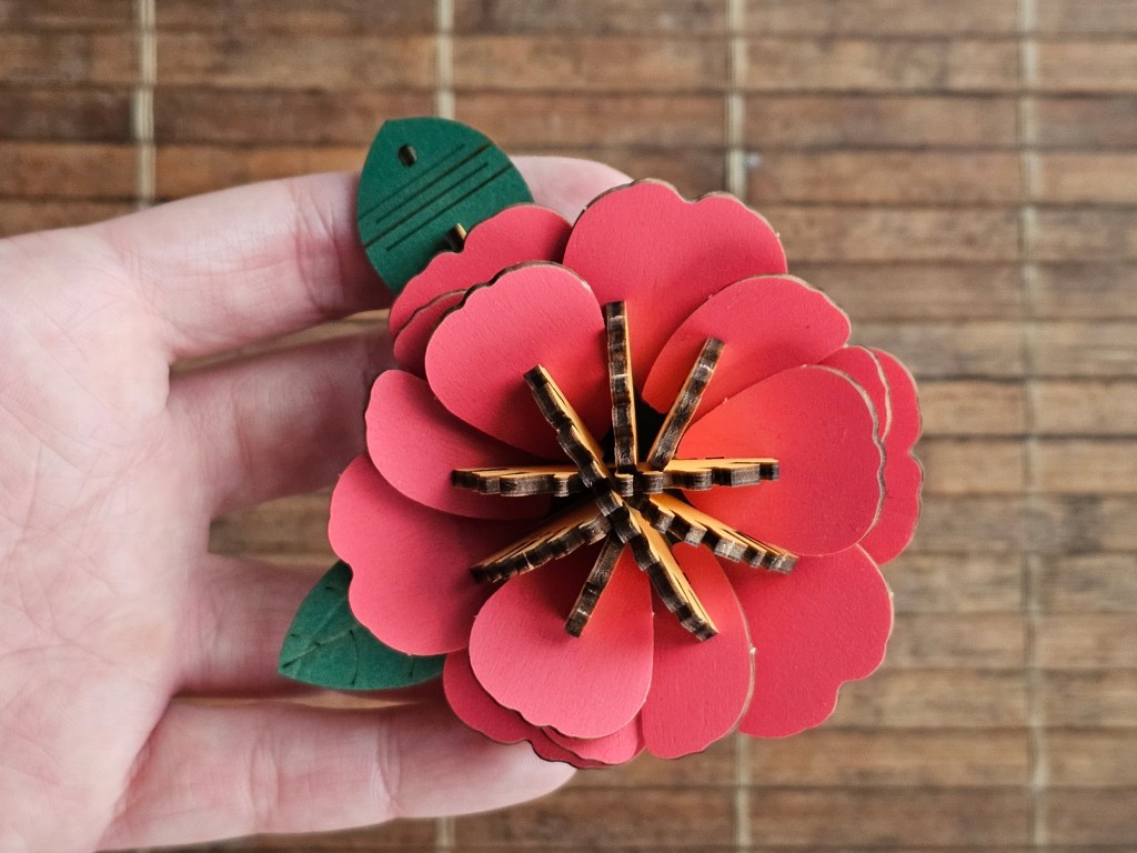 Nearly assembled red 3D wooden flower