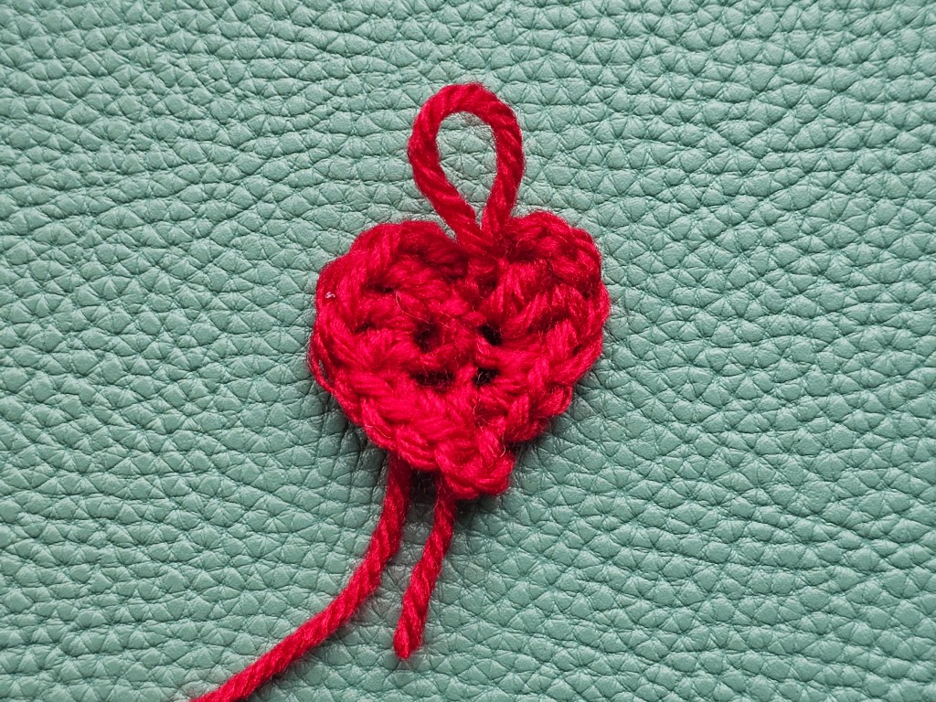 Tiny crocheted red heart