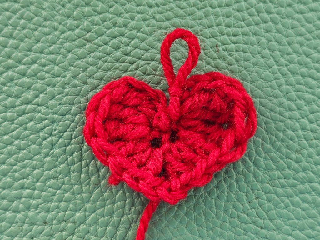 Tiny crocheted red heart
