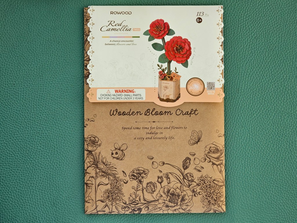 Front cover of a 3D wooden puzzle for making red flowers