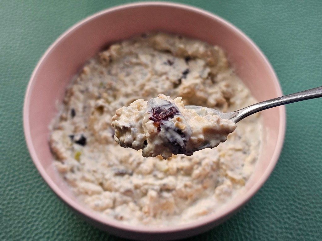 Ready to eat overnight Bircher oats, in a pink bowl