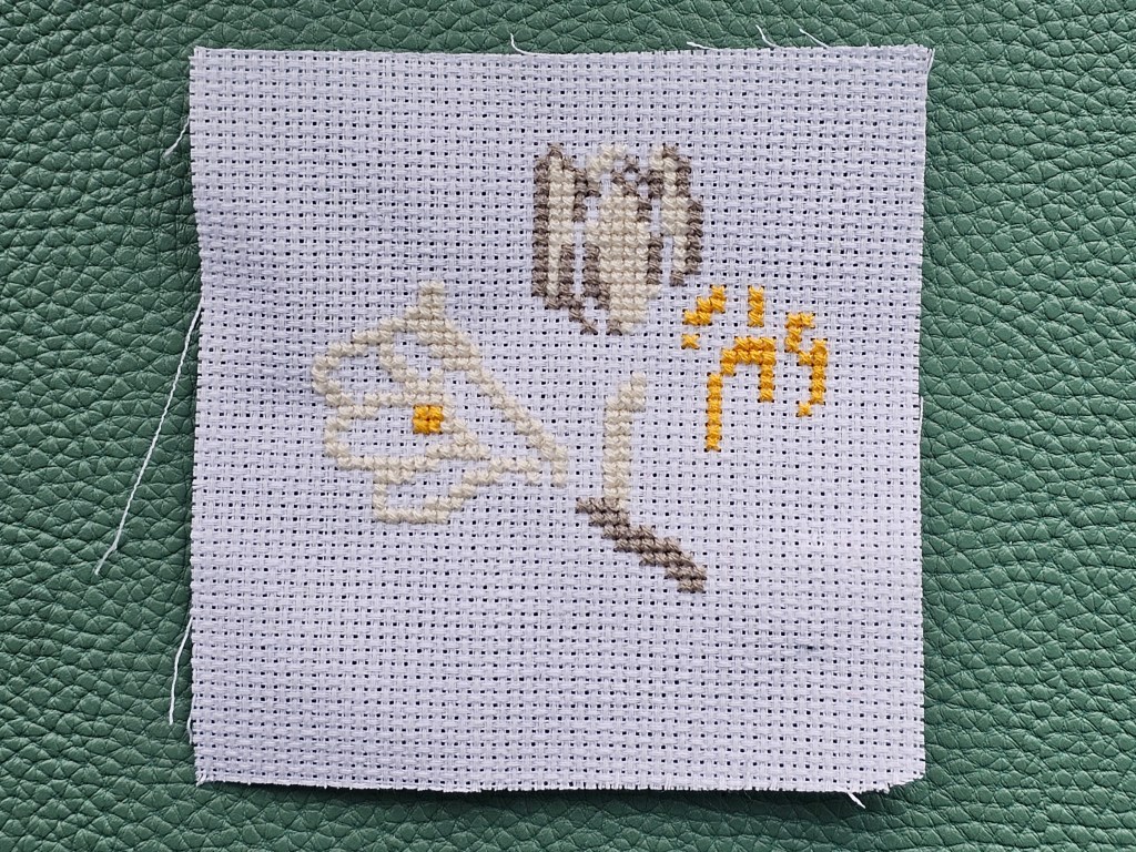Partially completed crocus cross stitch from an assorted RHS cross stitch kit