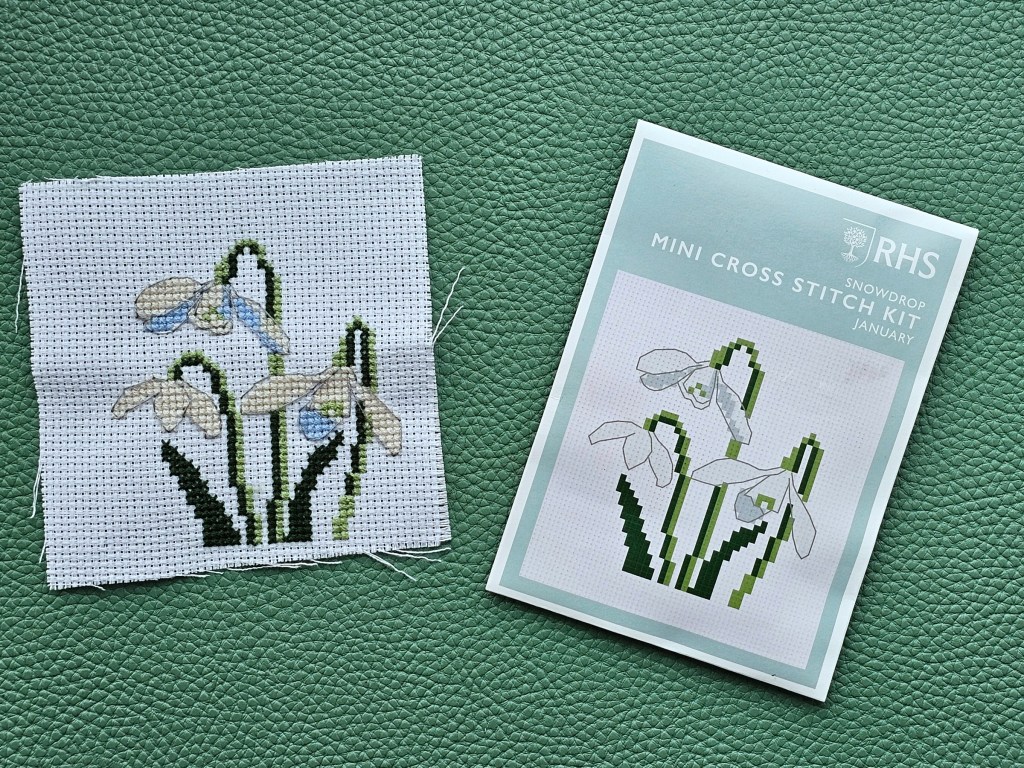 Finished small cross stitch design featuring snowdrops