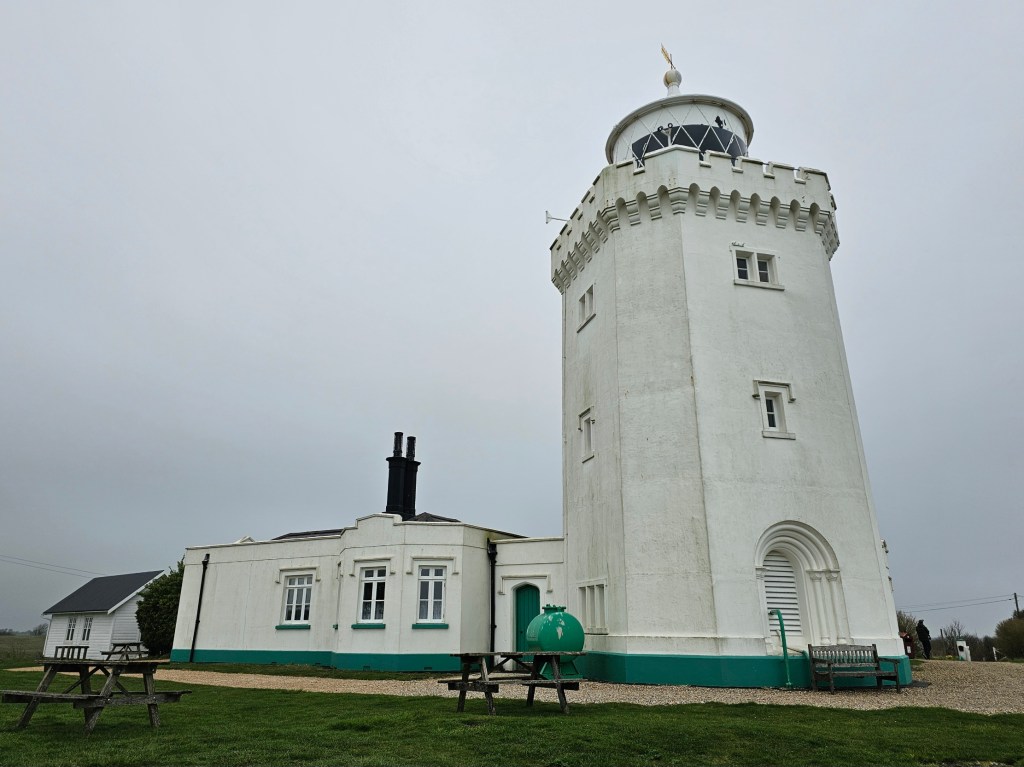 An old lighthouse on the white cliffs of Dover in England.