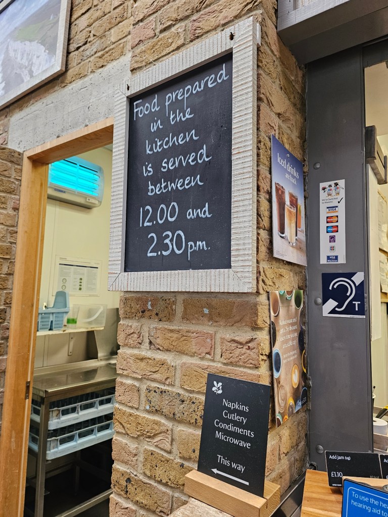 A sign hanging in the Dover visitor centre, saying that kitchen only serves hot meals for a short time around midday.