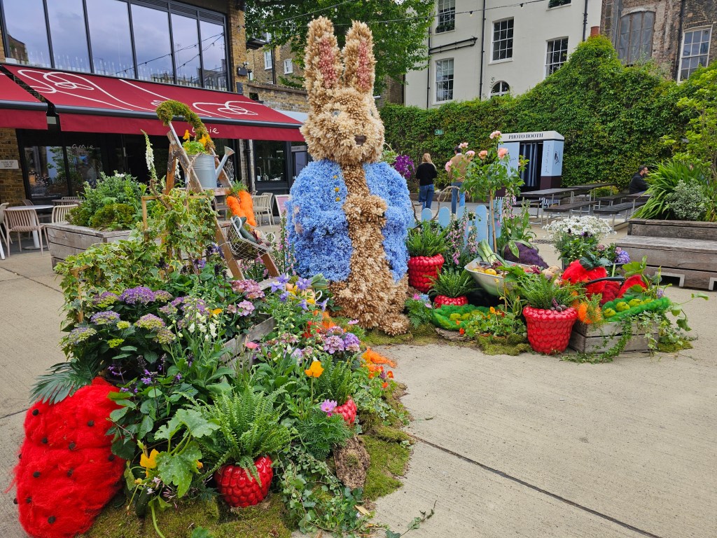 Floral display depicting Peter Rabbit made out of flowers. Photo taken during Belgravia in Bloom 2026 in London