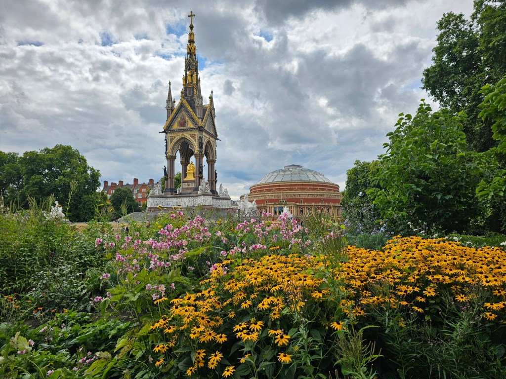 Pink and yellow flowers. Albert Monument and Royal Albert Hall can be seen in the background