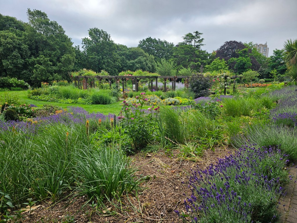 Flower garden in West Ham Park, London, on a cloudy day