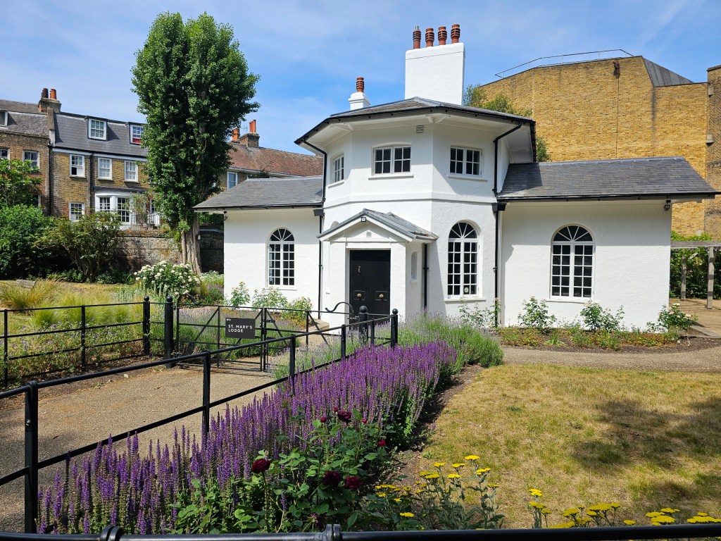 A small, white house next to a herb garden in Greenwich Park, London