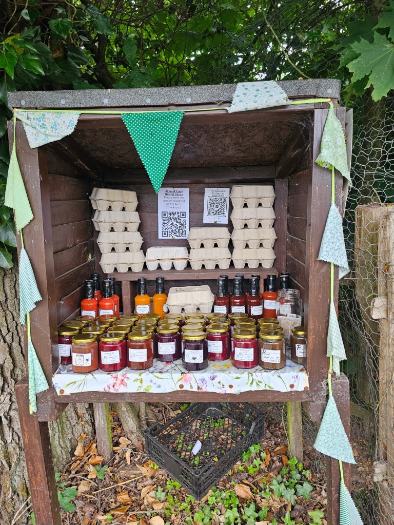 A stand with homemade jams and eggs