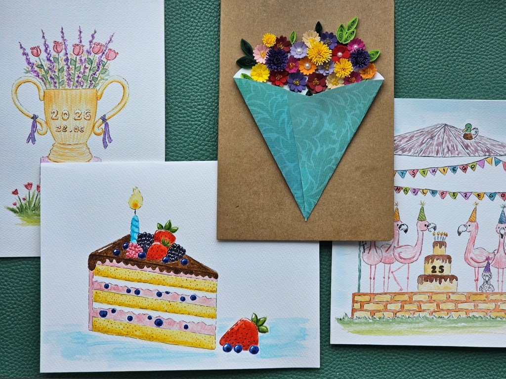 4 unique handmade cards: a watercolour slice of cake, a watercolour best dad trophy, a watercolour flamingo party, and a quilled flower bouquet