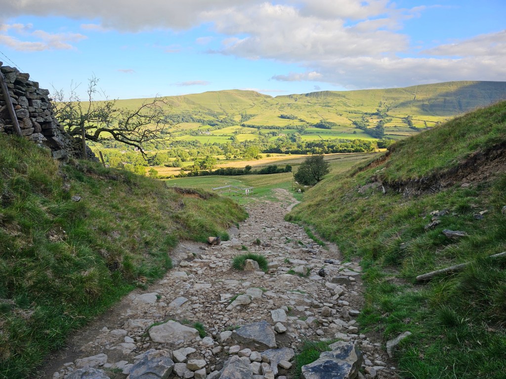 A rocky path cutting through the hills near Edale in Peak District