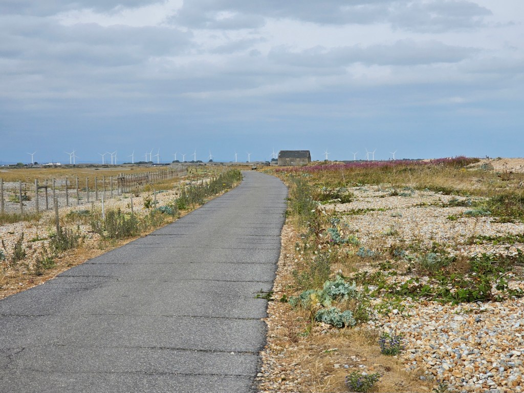 An asphalt path to Rye Harbour from Pett