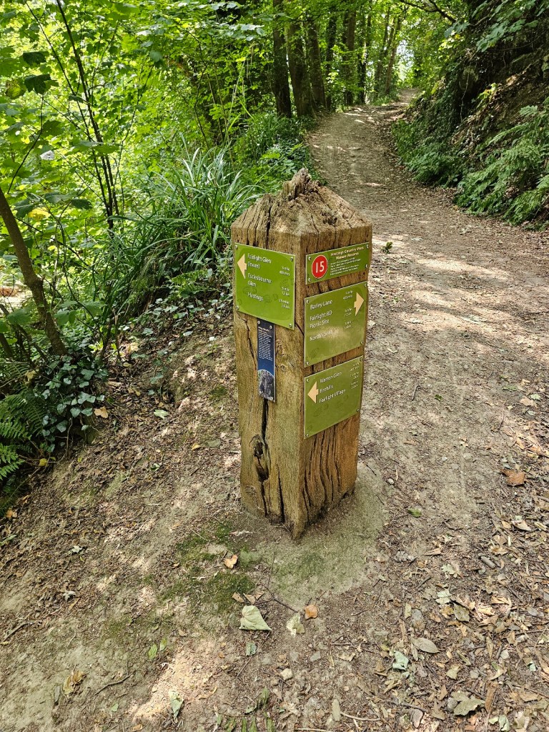 A signpost in Hastings Country Park, on a woodland trail