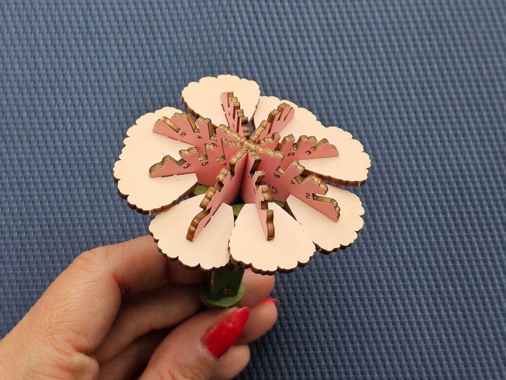 Half finished wooden pink carnation flower