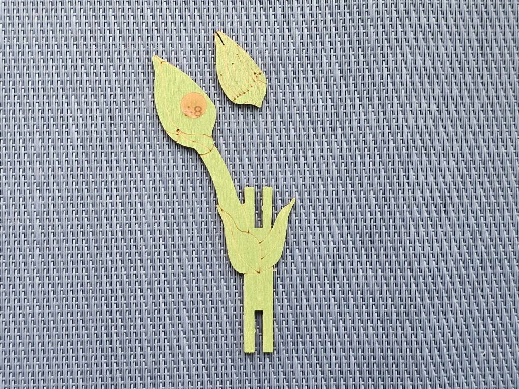 Assembling a green wooden stem for carnation flowers