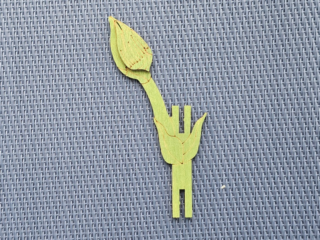 Assembling a green wooden stem for carnation flowers