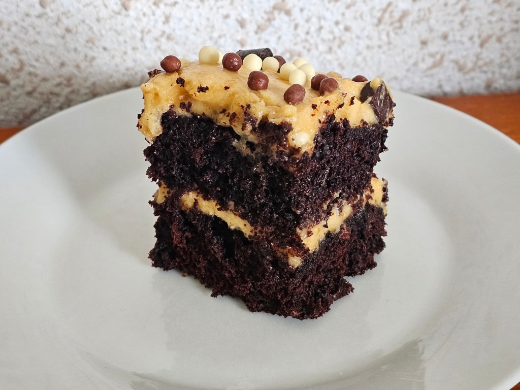 A slice of egg-free salted peanut butter chocolate cake