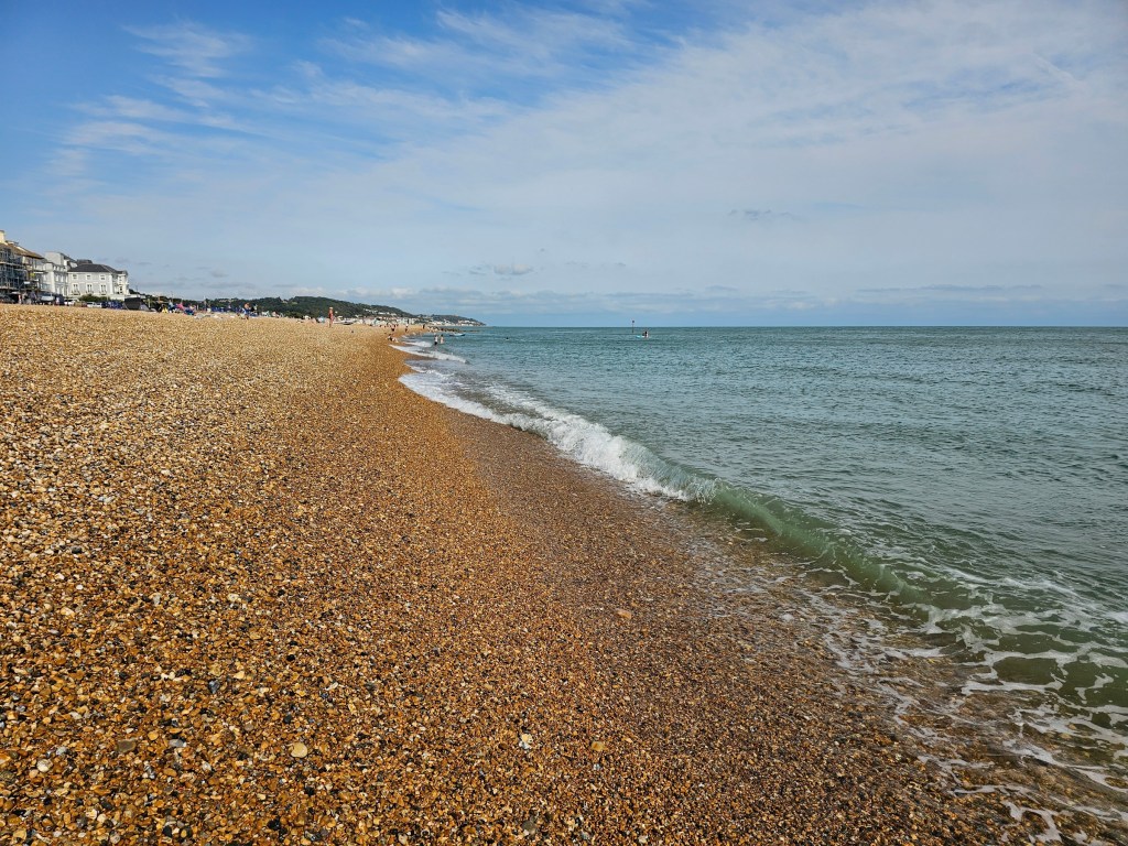 Wide, pebbe beach near Hythe and the sea