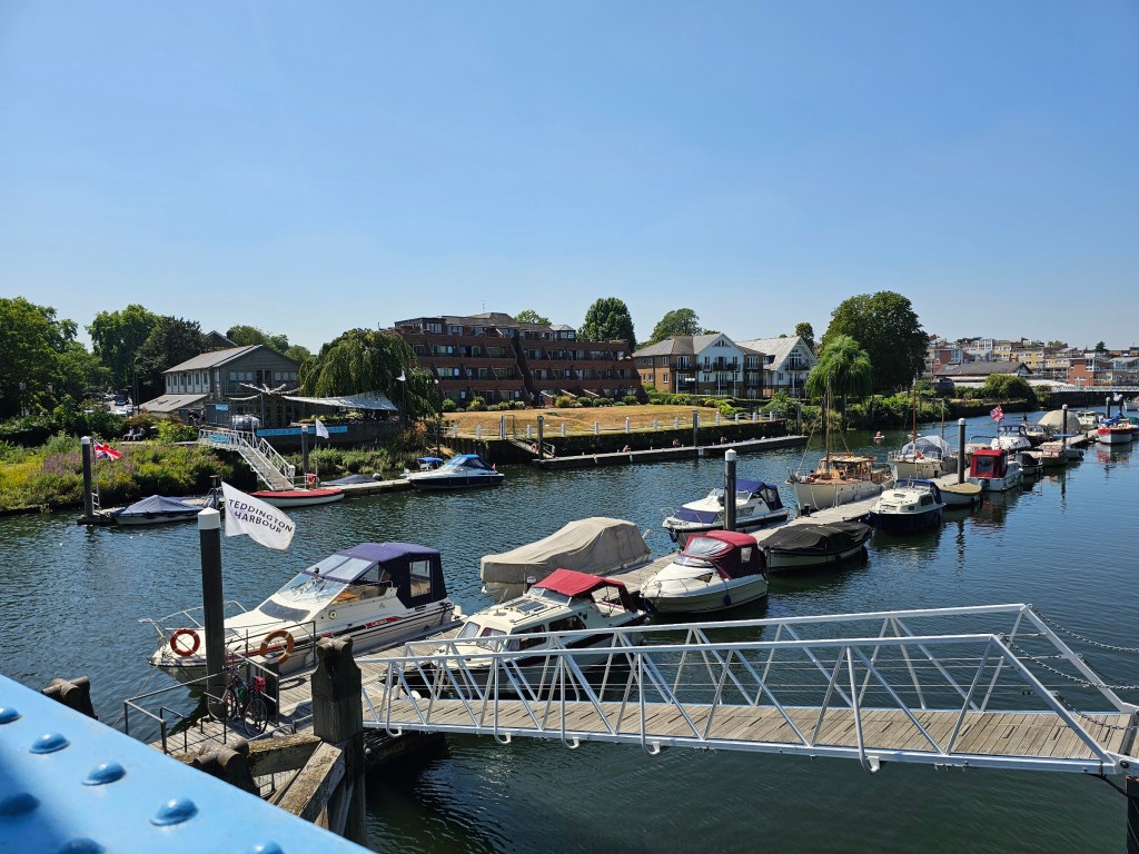 Rows of small boats on River Thames in Teddington Harbour