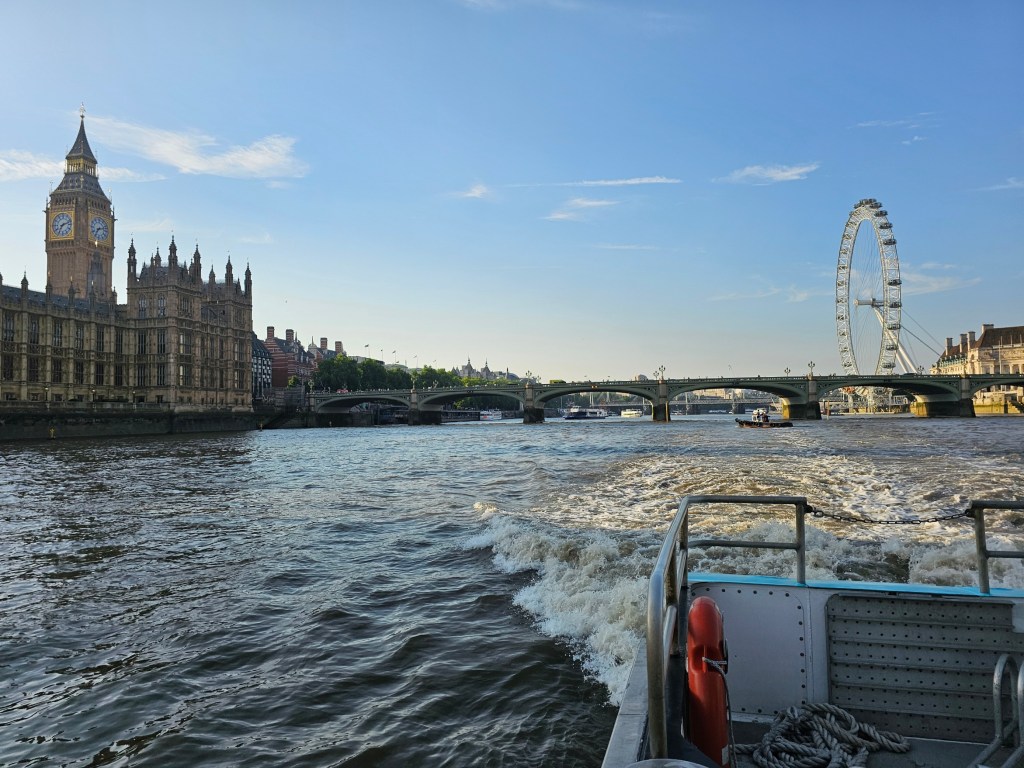 The view of London Eye, Big Ben and Houses of Parliament seen from an Uber boat