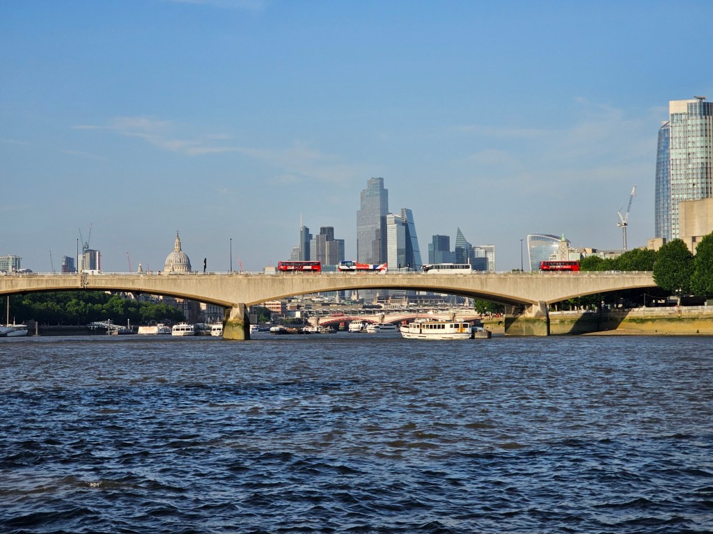 The view of City of London and St Paul's Cathedral seen from an Uber Boat