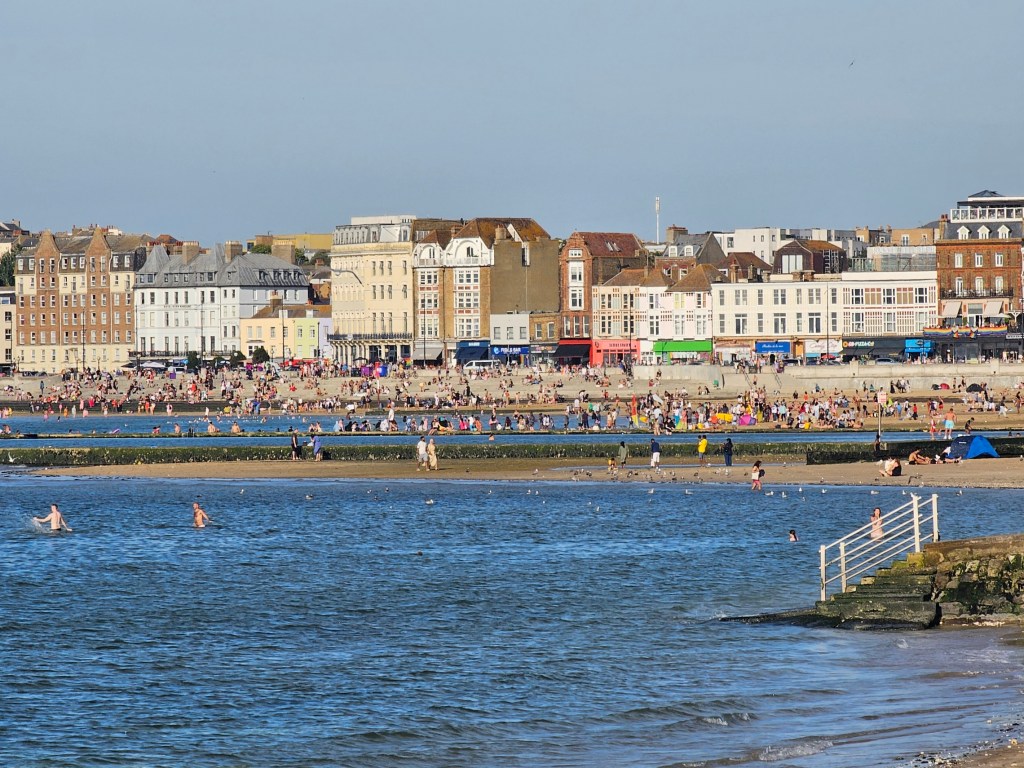 The crowds on the beach in Margate on a summer day. Photo taken from afar