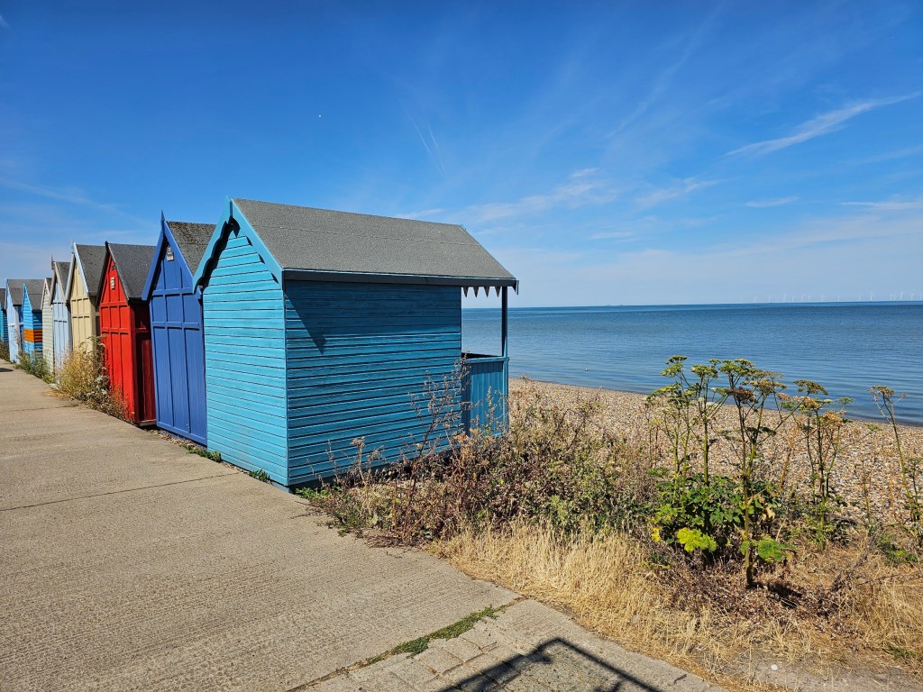 Colourful beach huts by the sea near Whitstable