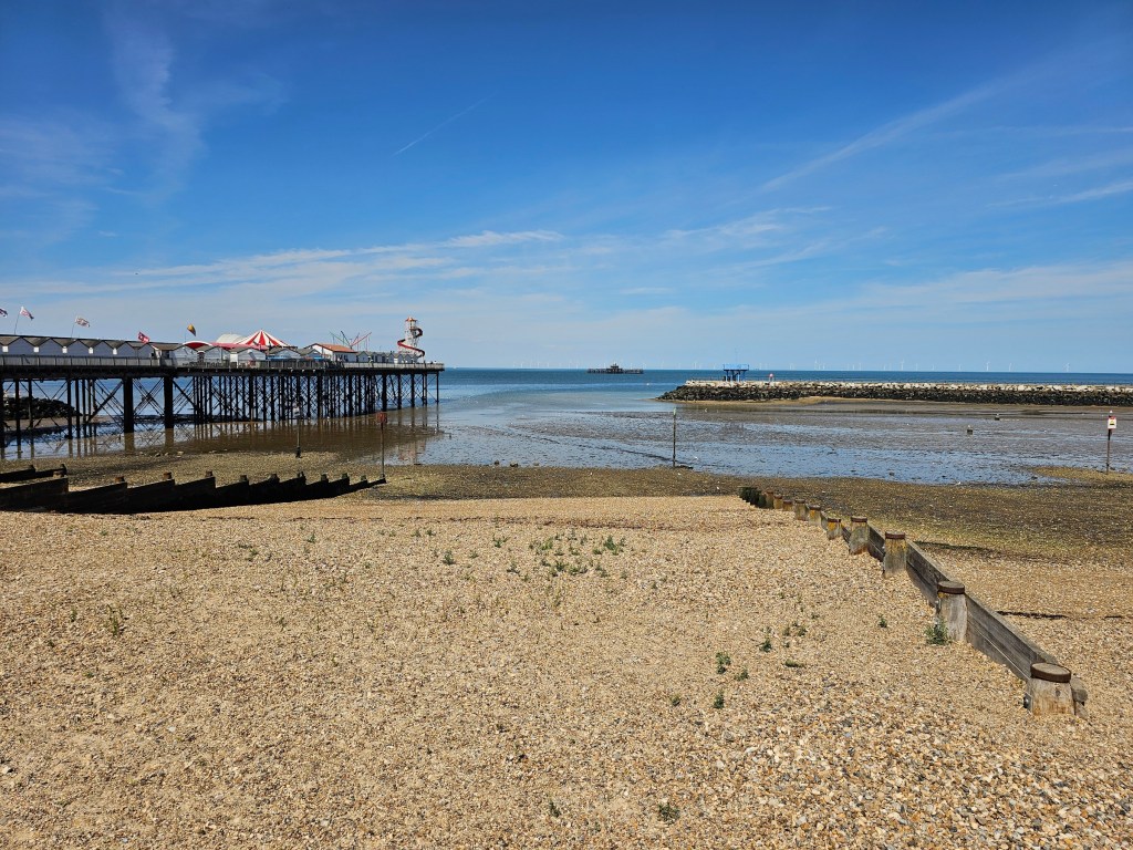 The pier and harbour arm seen from the pebble beach in Herne Bay