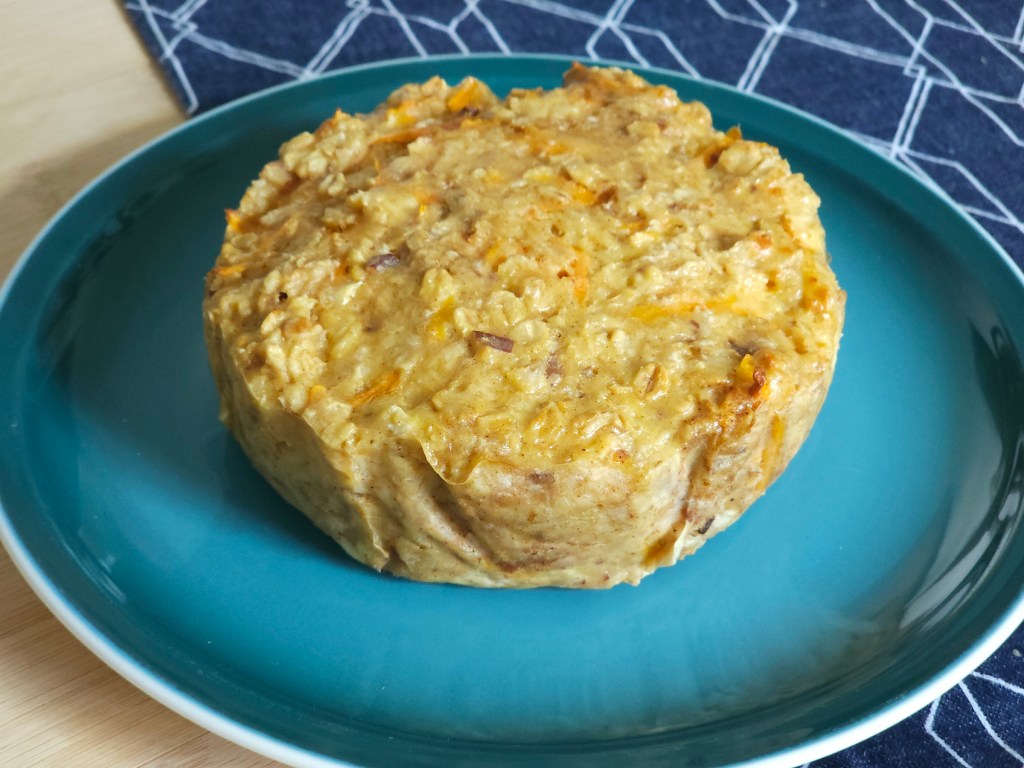 Baked carrot cake oats for one, on a plate.