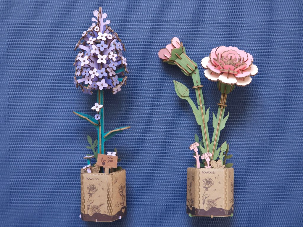 Two assembled wooden 3D flowers: lilac and carnations