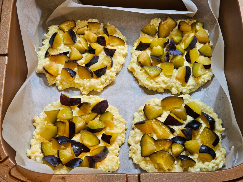 Four high protein plum pastries before baking.