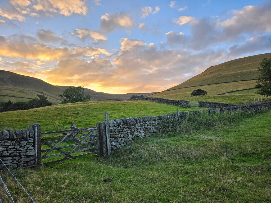 Sunset behind the hills of Peak District